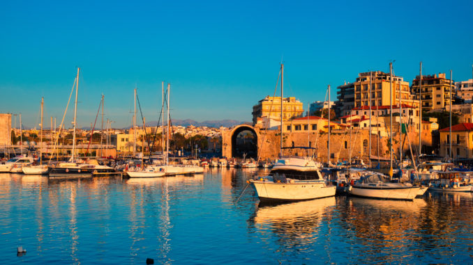 Venetian Fort in Heraklion and moored fishing boats, Crete Island, Greece